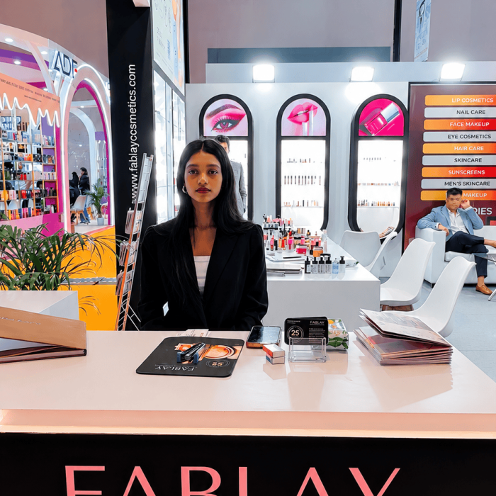 FABLAY Cosmetic Formulations exhibition booth showcasing cosmetics and beauty products with a professional representative