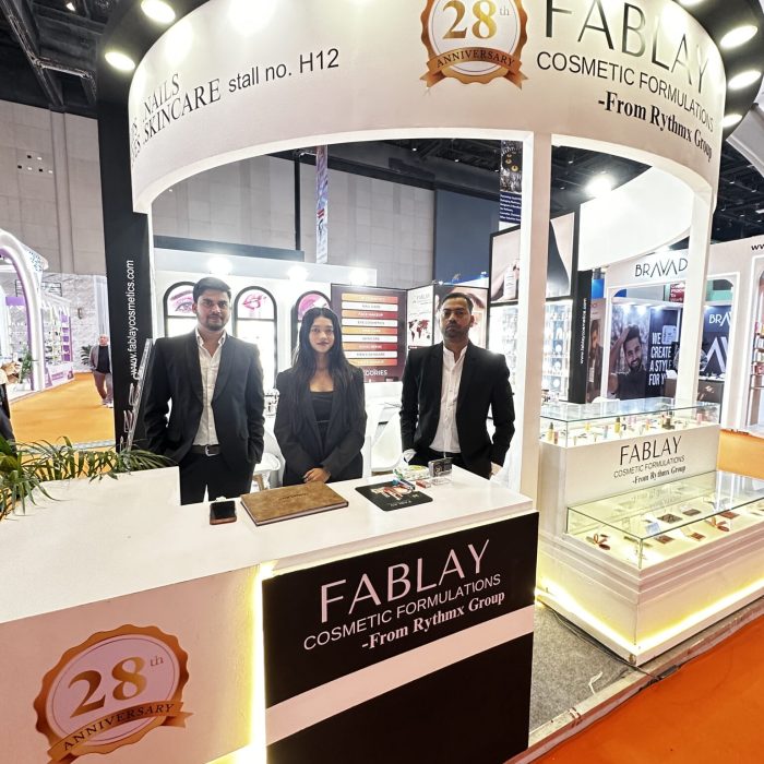 Fablay Cosmetic Formulations team at a cosmetics exhibition booth showcasing private label products